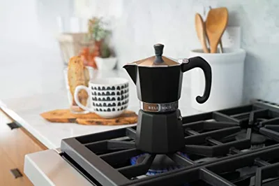 Stovetop Espresso Maker, 3-Cup Moka Pot, Black, in use.