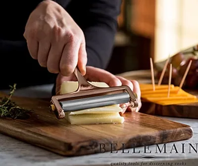 Stainless Steel Wire Cheese Slicer with 2 Extra Wires, Gold, in use.