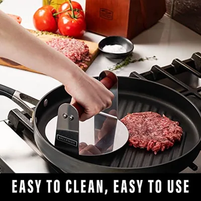 Stainless Steel Round Smash Burger Press 6 inches Burger Smasher, Silver, photographed on a counter.
